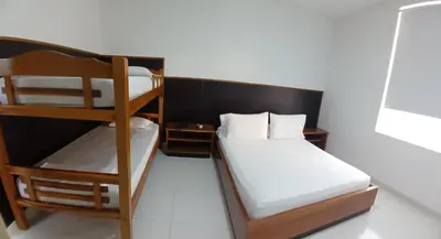 a bedroom with two bunk beds and a window at Hotel Boutique High Park in Cartagena de Indias