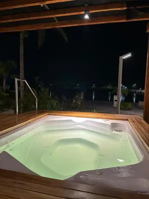 a jacuzzi tub in a patio at night at Baia Kristal Andrés Cartagena in Cartagena de Indias
