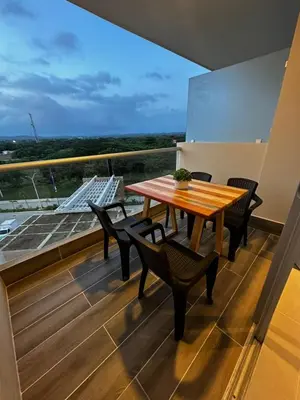 a table and chairs on a balcony with a view at Baia Kristal Andrés Cartagena in Cartagena de Indias