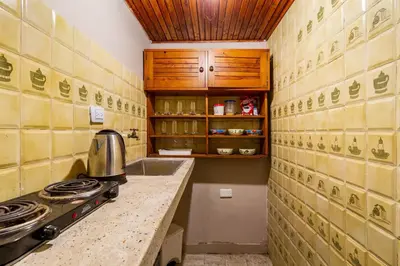 a kitchen with a stove and a counter top at Casa Cristi #5 in Cartagena de Indias