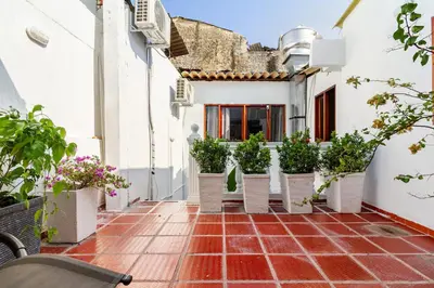 a courtyard of a house with potted plants at Casa Cristi #5 in Cartagena de Indias