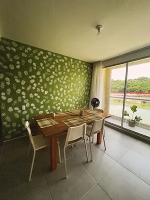 a dining room with a table and chairs and a window at Amazing apartment cerca the beach Manzanillo Sector in Cartagena de Indias