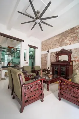 a living room filled with furniture and a ceiling fan at Alma Blanca - Colonial Loft in the Walled City in Cartagena de Indias