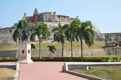 a statue of a man in front of a castle at Family house colonial-style in Cartagena de Indias