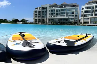 two surfboards sitting on the sand in a swimming pool at Ultimo piso, amplia terraza y vista impresionante! in Los Arrayanes