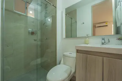 a bathroom with a shower and a toilet and a sink at Cartagena 2 Hab con Terraza Privada Playa 12 min Parking in Manzanillo del Mar