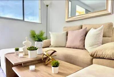 a living room with a couch and a table at Lindo apartamento a 5 minutos del mar!!! in Manzanillo del Mar