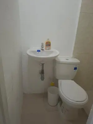 a bathroom with a toilet and a sink at Alojamiento Marbella Turismo in Cartagena de Indias