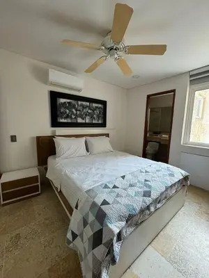 a bedroom with a bed with a ceiling fan at Marabierto Beachfront Escape in Arizona