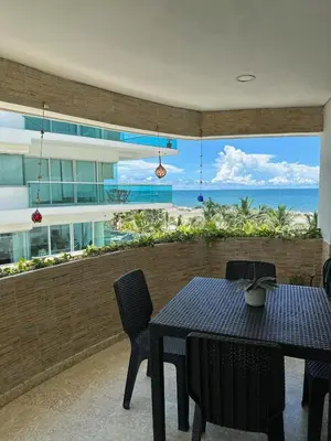 a dining room with a table and a view of the ocean at Marabierto Beachfront Escape in Arizona