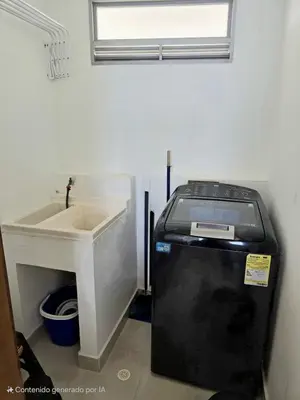 a small bathroom with a sink and a water heater at Ikigai frente al mar con piscina infinita y Gym in Cartagena de Indias