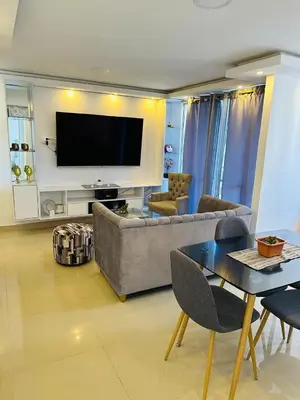 a living room with a couch and a table at Apartamento en Barranquilla Alameda del Rio in Barranquilla