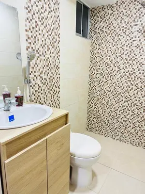 a bathroom with a white sink and a toilet at Apartamento en Barranquilla Alameda del Rio in Barranquilla