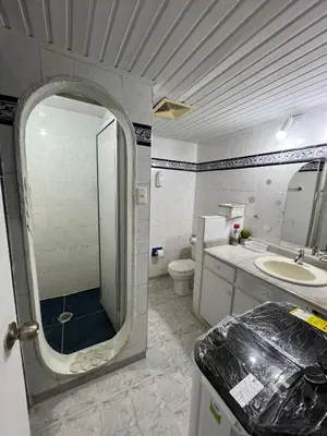 a bathroom with a sink and a toilet and a mirror at Apartamento turístico cerca al mar in Cartagena de Indias