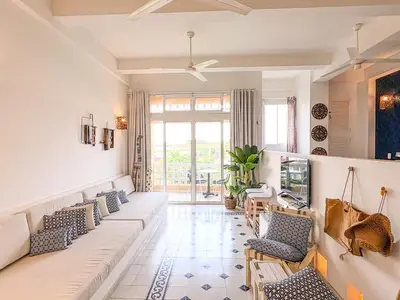 a living room with couches and a tv at Bohemia home Getsemaní in Cartagena de Indias