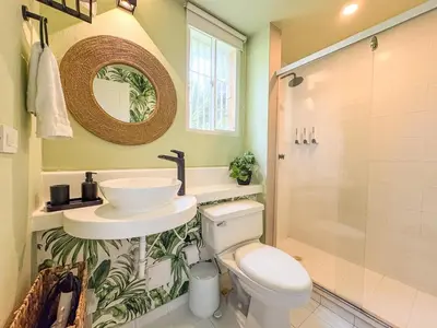 a bathroom with a sink and a toilet and a shower at Bohemia home Getsemaní in Cartagena de Indias