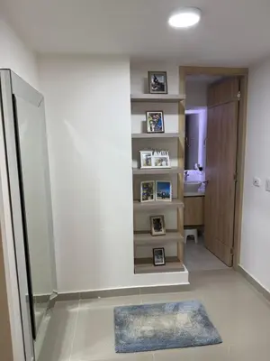 a bathroom with a walk in shower next to a wall at Apartamento moderno para rentar por Días - Nuevo in Barranquilla