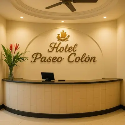 a hotel lobby with a hotel passgas color sign on the wall at Hotel Paseo Colon in Barranquilla