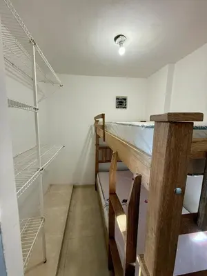a room with two bunk beds and a staircase at First floor house in Barranquilla