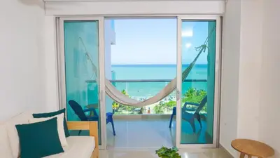 a living room with a view of the ocean at Magico Apartamento Frente al Mar 3 Habitaciones AR53 in Coveñas