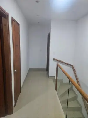 an empty hallway with a staircase and a door at Guest House with AC, close to Historical Centre 3 in Cartagena de Indias