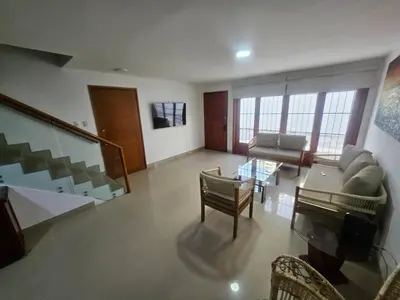 a living room with a couch and a piano at Guest House with AC, close to Historical Centre 3 in Cartagena de Indias