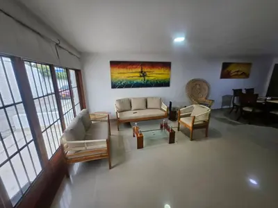 a living room with a couch and a table at Guest House with AC, close to Historical Centre 1 in Cartagena de Indias