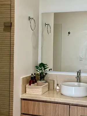 a bathroom with a sink and a mirror at Luxury Apartment betwen Cartagena and Barranquilla in Juan de Acosta