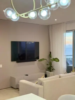 a living room with a flat screen tv on the wall at Luxury Apartment betwen Cartagena and Barranquilla in Juan de Acosta