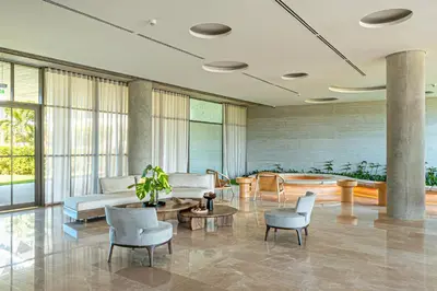 a lobby with a couch and chairs and a table at Deluxe en MorrosEos con piscina privada y salida a la playa in Cartagena de Indias
