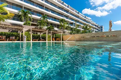 a swimming pool in front of a building at Deluxe en MorrosEos con piscina privada y salida a la playa in Cartagena de Indias
