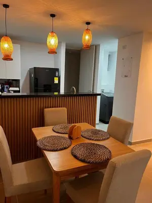 a dining room table with chairs and a tableasteryasteryasteryasteryasteryasteryastery at Vicmag House Barranquilla in Barranquilla