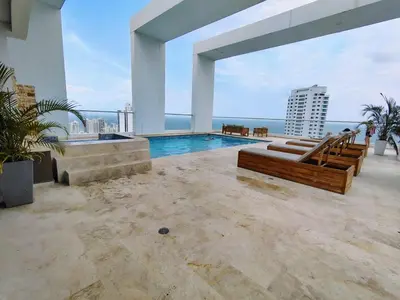 a swimming pool on the roof of a building at Apartamento en Edificio Magno Loft Apto DP 1001 in Cartagena de Indias
