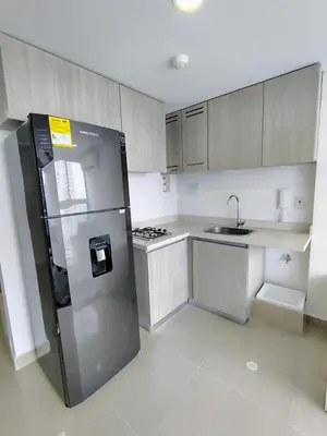 a kitchen with a stainless steel refrigerator and a sink at Apartamento en Edificio Magno Loft Apto DP 1001 in Cartagena de Indias