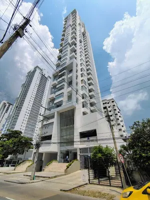 a tall white building with two tall buildings at Apartamento en Edificio Magno Loft Apto DP 1001 in Cartagena de Indias