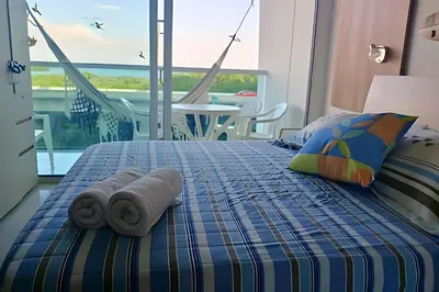 a bedroom with a bed with towels on it at Relax garantizado en Los Morros in Cartagena de Indias