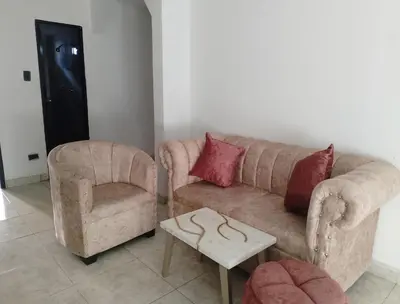 a living room with a couch and a chair at Alto prado 75 house in Barranquilla