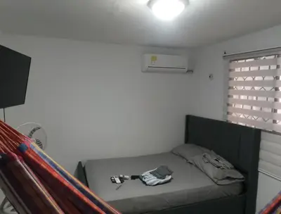 a room with a bed in a room at Alto prado 75 house in Barranquilla