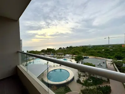 a balcony with a view of a swimming pool at Apartamento familiar en Santa Marta con vista al mar y la Sierra in Santa Marta
