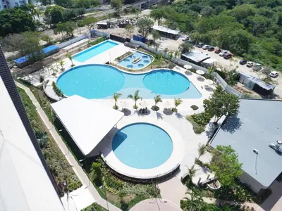an overhead view of two pools at a resort at Apartamento familiar en Santa Marta con vista al mar y la Sierra in Santa Marta