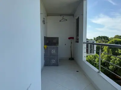 a balcony of a house with a view of trees at Apartment 402 Tolú 2 habitaciones in Tolú