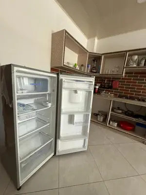 a refrigerator with its door open in a kitchen at Apartment 402 Tolú 2 habitaciones in Tolú