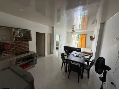 a kitchen and dining room with a table and chairs at Apartment 402 Tolú 2 habitaciones in Tolú