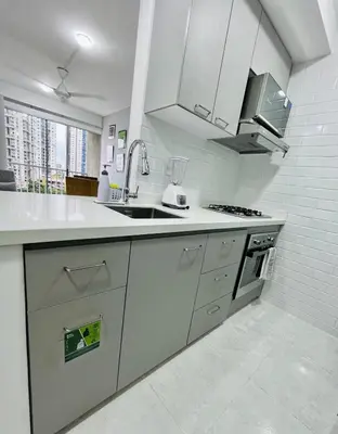 a white kitchen with a sink and a stove at Beach Nearby Stunning Views Ultimate Comfort in Cartagena de Indias