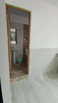a bathroom with a toilet and a sink and a mirror at MiraMar in Guayabal