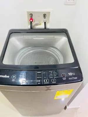 a washing machine with the door open on top of it at Ocean Drive Cartagena Apto con Piscina Infinity in Cartagena de Indias