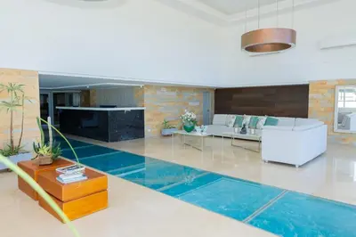 a living room with a swimming pool in the floor at Ocean Drive Cartagena Apto con Piscina Infinity in Cartagena de Indias