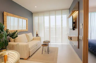 a living room with a couch and a bed at Baia Kristal Top Floor-Elegance and Luxury View in Los Arrayanes