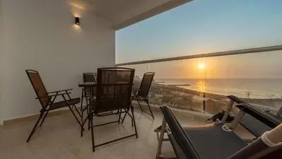 a room with chairs and a view of the ocean at Maravillosa suite frente al mar y atardecer CB911 in Cartagena de Indias