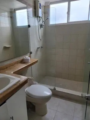a bathroom with a shower and a toilet and a sink at Large and beautiful Oceanfront Penthouse in Cartagena de Indias